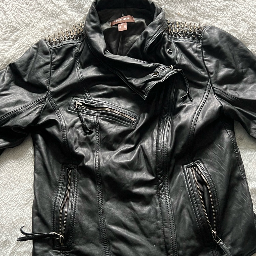 Genuine Danier leather hand spiked shoulders.